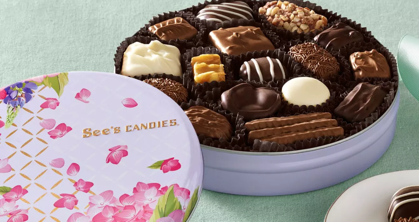 See's Candies Spring edition, light green background with a purple tin full of chocolates