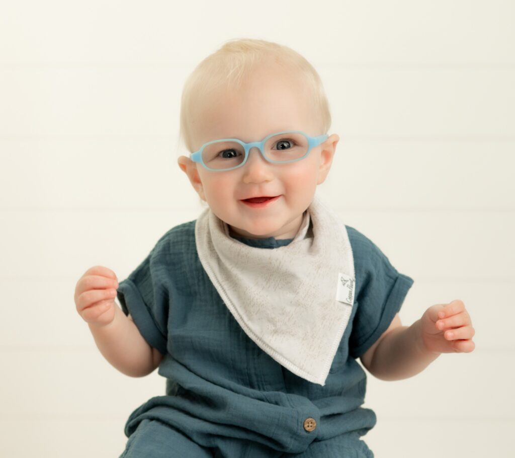 Baby Maverick in blue glasses
