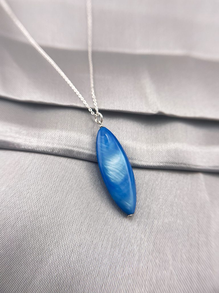 beautiful sky blue acrylic pendant set in sterling silver with an 18-inch sterling silver cable chain.
