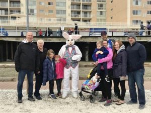 Large family group posing with the Easter bunny.