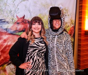 Courtney and Luca wearing zebra stripes.