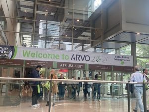 Entrance to the ARVO 2024 Annual Meeting with attendees walking through the atrium lobby