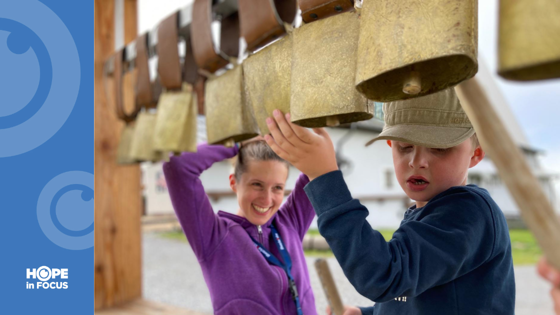 Laura and Enzo playing with cow bells