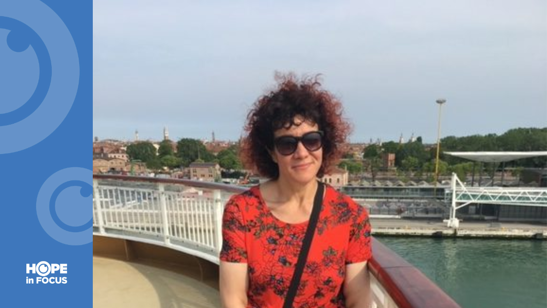 Damiana Harper in sunglasses with water behind her