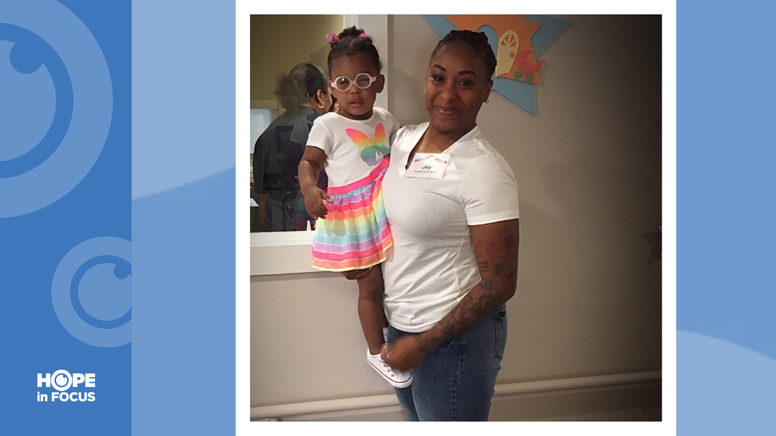 Jordynn being held by her mom, Joy