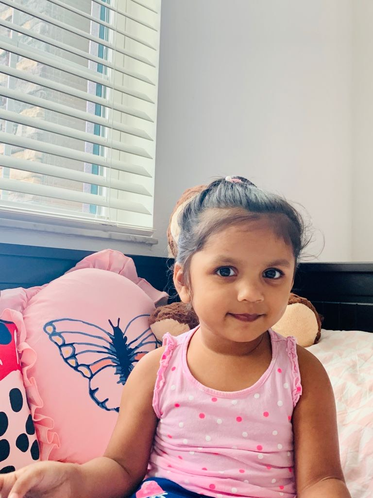Parvi wearing a pink tank top 