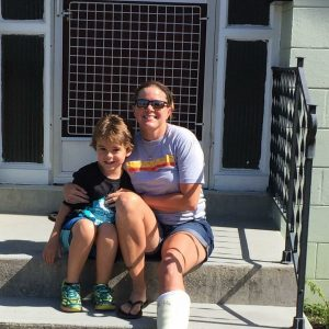 Creed and his mom Sarah sitting on steps.