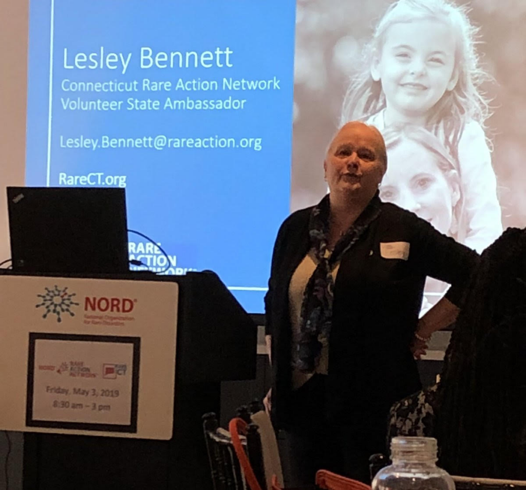 Lesley Bennet presenting on a podium