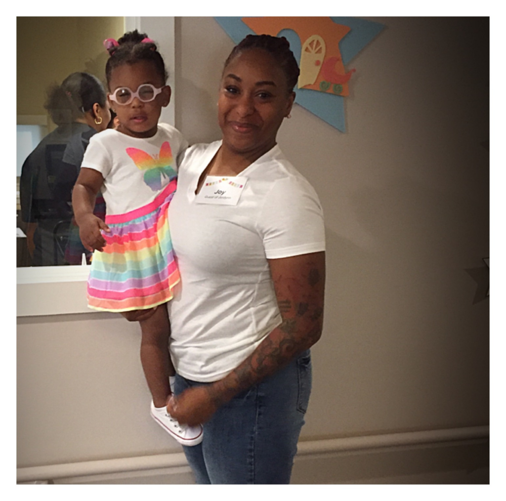 Jordynn being held by her mom, Joy