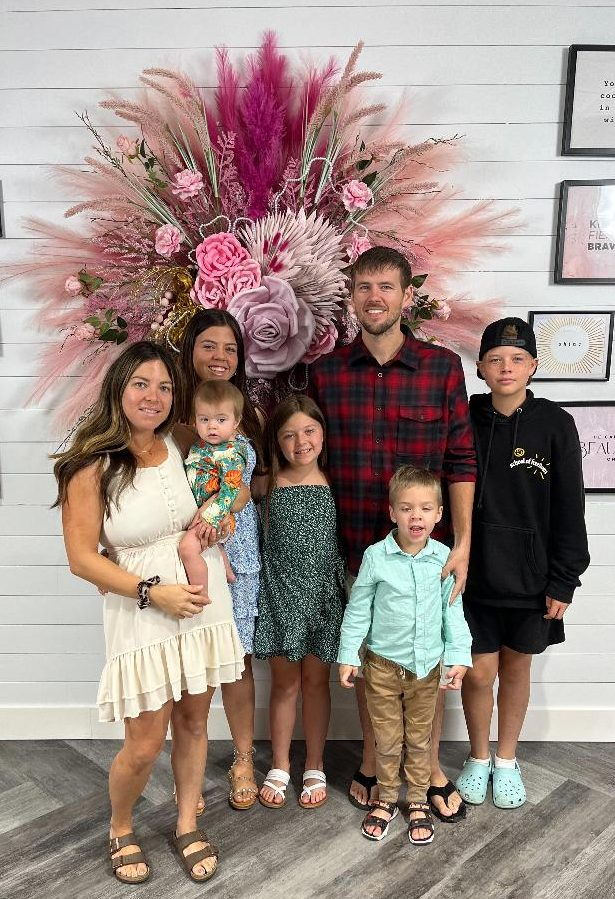 The Johnson Family: (L) Stephanie (mom) holding Addisyn; Faith (behind Addisyn); Emma, Brian (dad), Noah, and Ryan