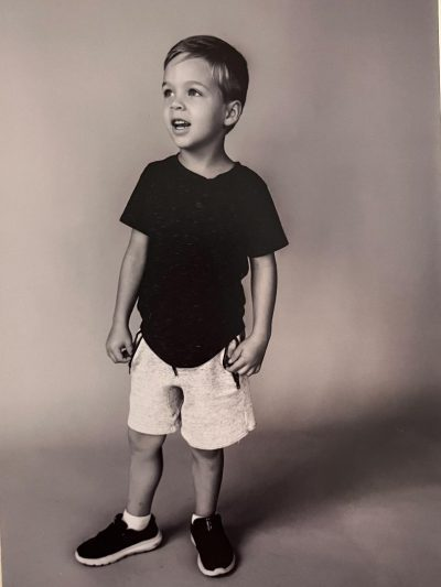 Black and white photo of Noah standing