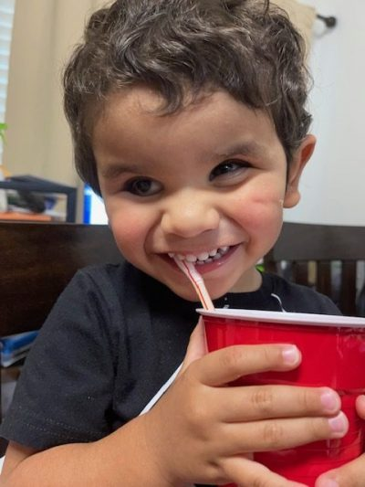 James holding a red solo cup and smiling.