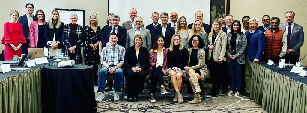 A large group of people posing for picture at the Global RDH12 Scientific Conference