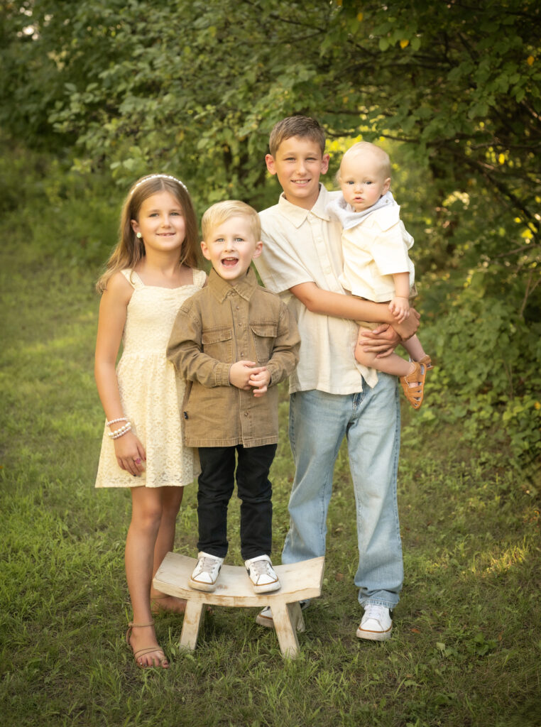 The Geffre kids in a green space