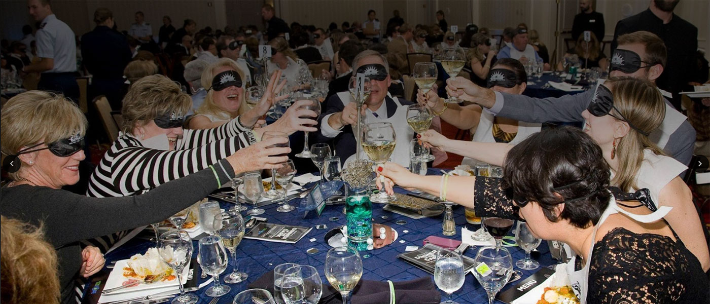People with blindfolds cheering