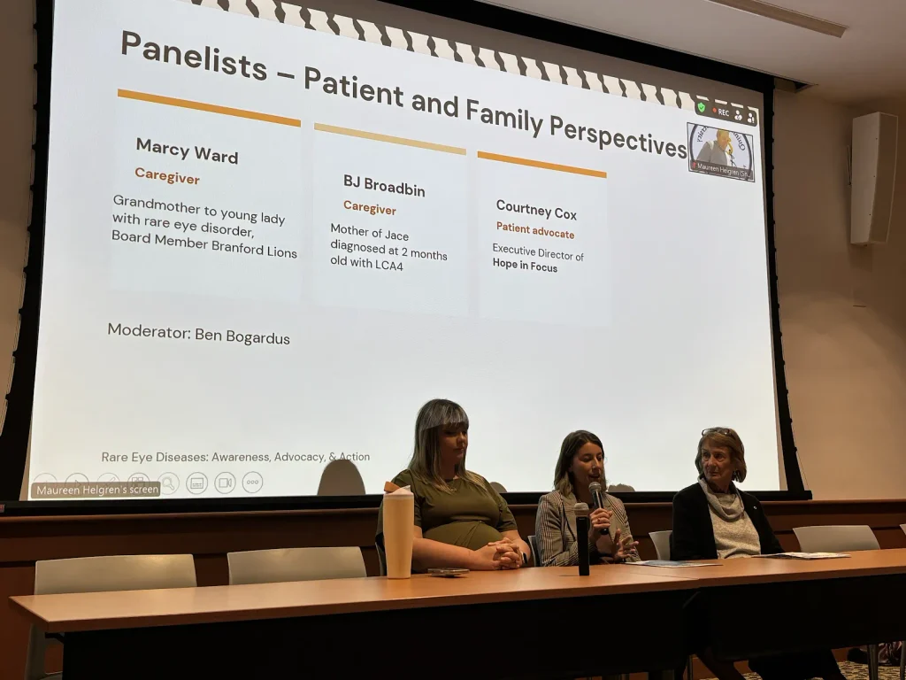 Courtney Coates, DJ Broadbin and Marcy Ward speaking on panel with presentation behind them
